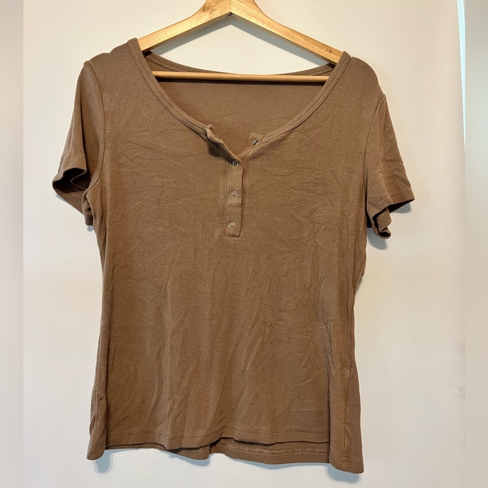 unsure of the brand name, fits like a medium, darker beige color